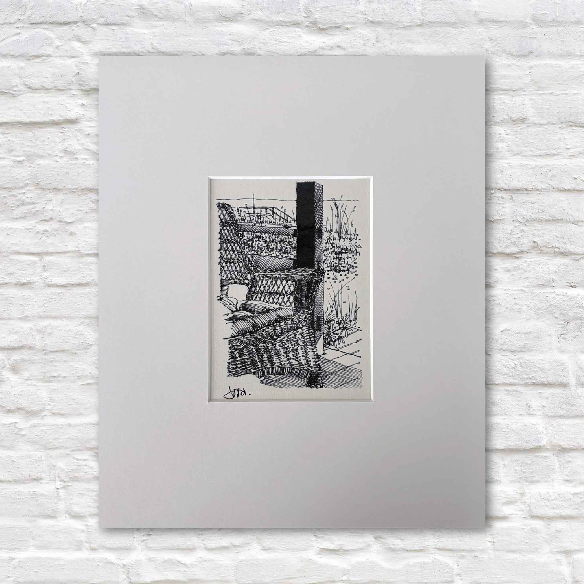 Pawleys Island Wicker Chair II by Todd Halamka is a detailed pen-and-ink fine art print featuring a classic wicker porch chair overlooking the dunes of Pawleys Island, South Carolina. Available at Gray Man Gallery, this professionally matted print fits a standard ready-made frame, making it easy to display without custom framing.