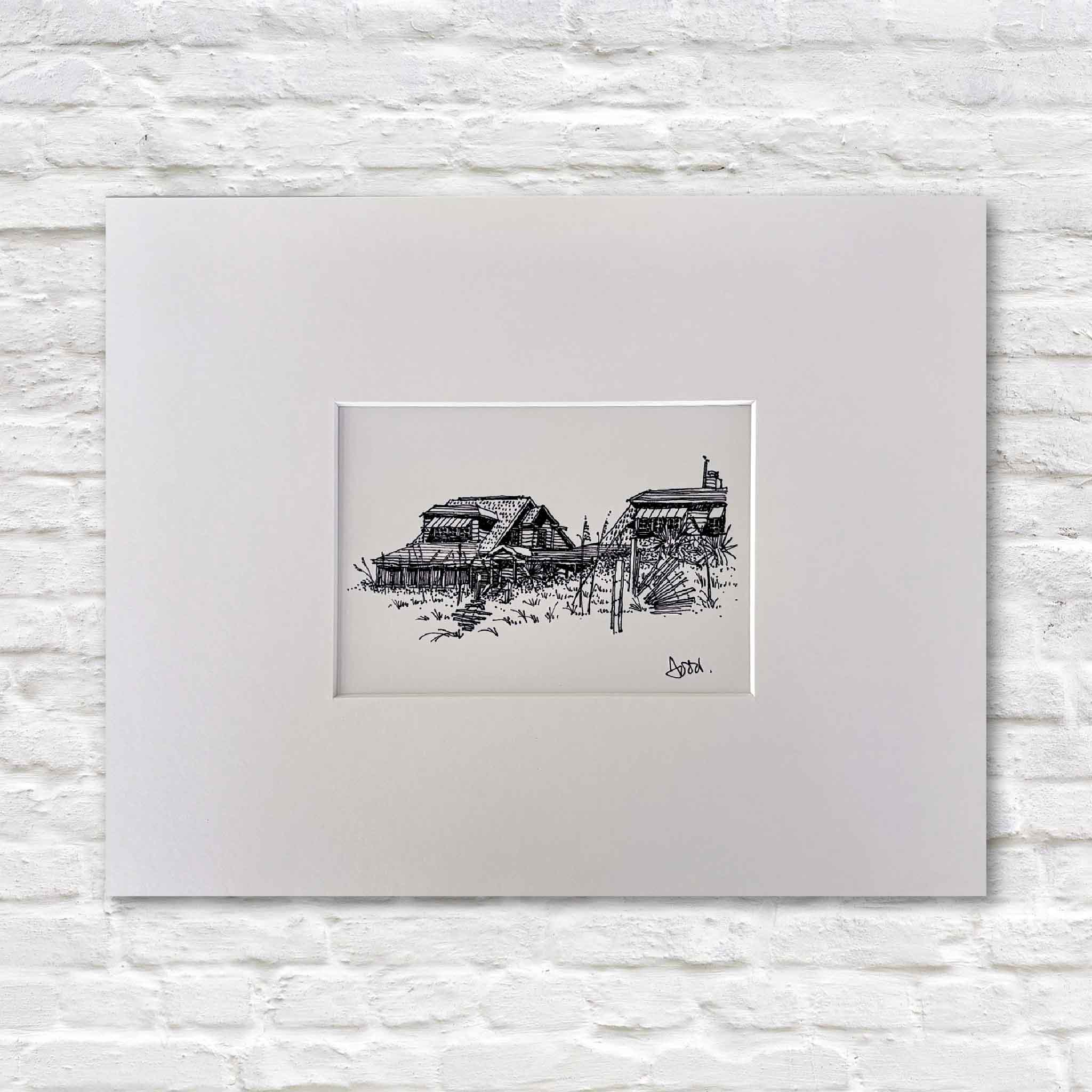 Two Beach Houses III by Todd Halamka, a detailed pen-and-ink print featuring classic Pawleys Island beach houses nestled behind dune grasses. Professionally matted and available at Gray Man Gallery in Pawleys Island, South Carolina, this nostalgic coastal artwork celebrates the charm and character of Old Pawleys.