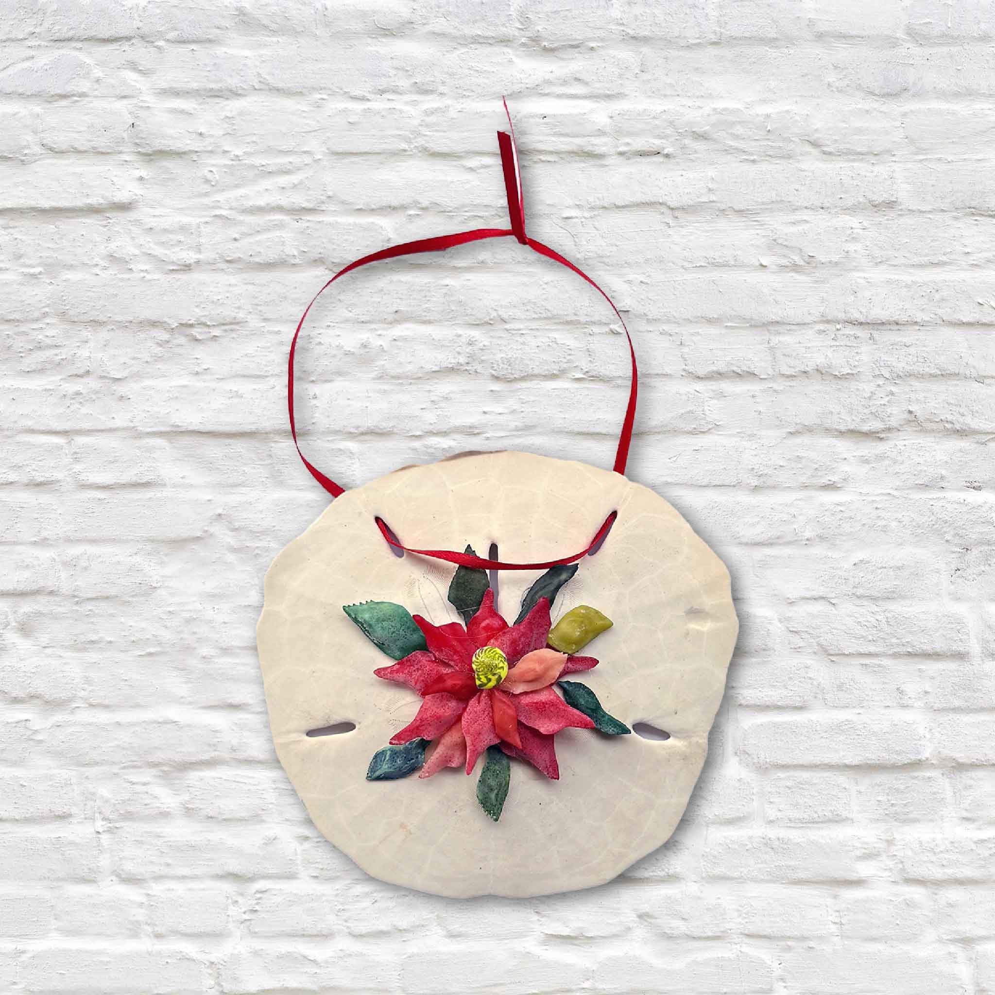 Sand dollar Christmas ornament with handcrafted poinsettia design by Tootsie Watkins
