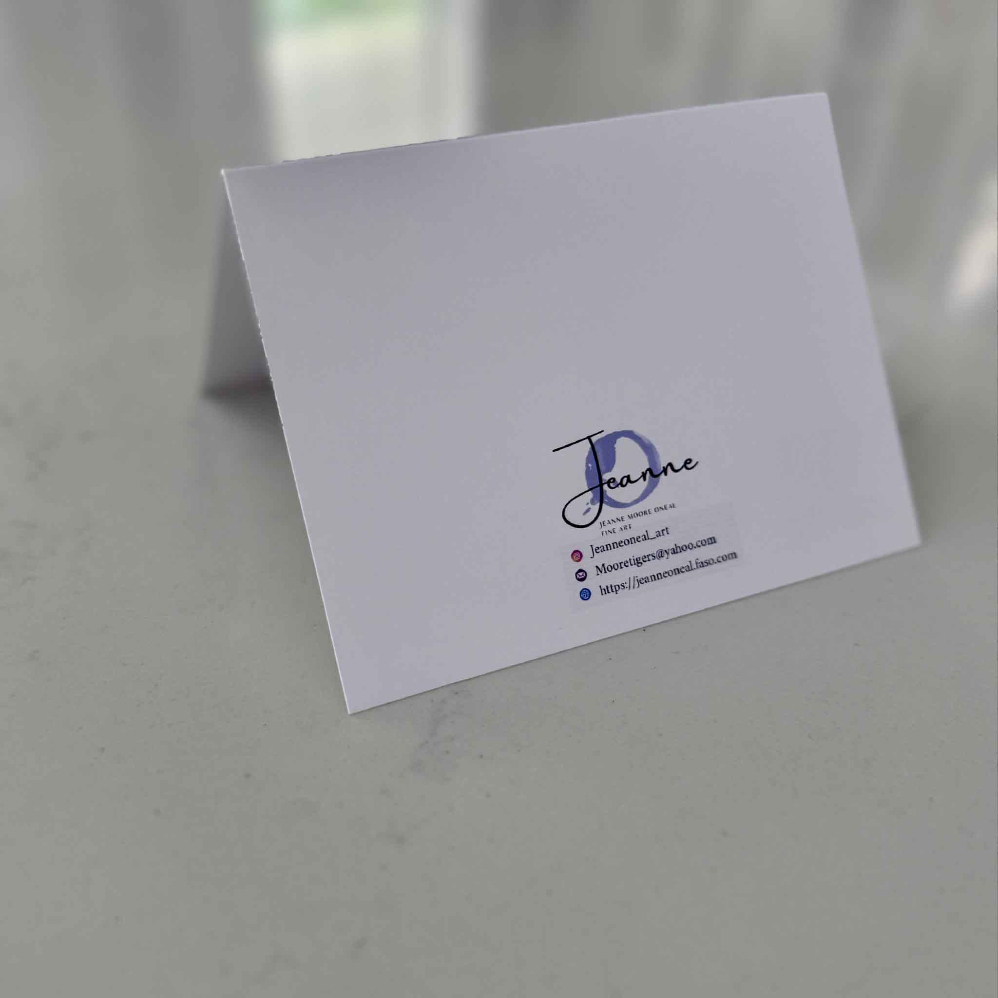 Back of notecard displaying artist information for Jeanne O’Neal, a local Lowcountry artist represented by Gray Man Gallery.