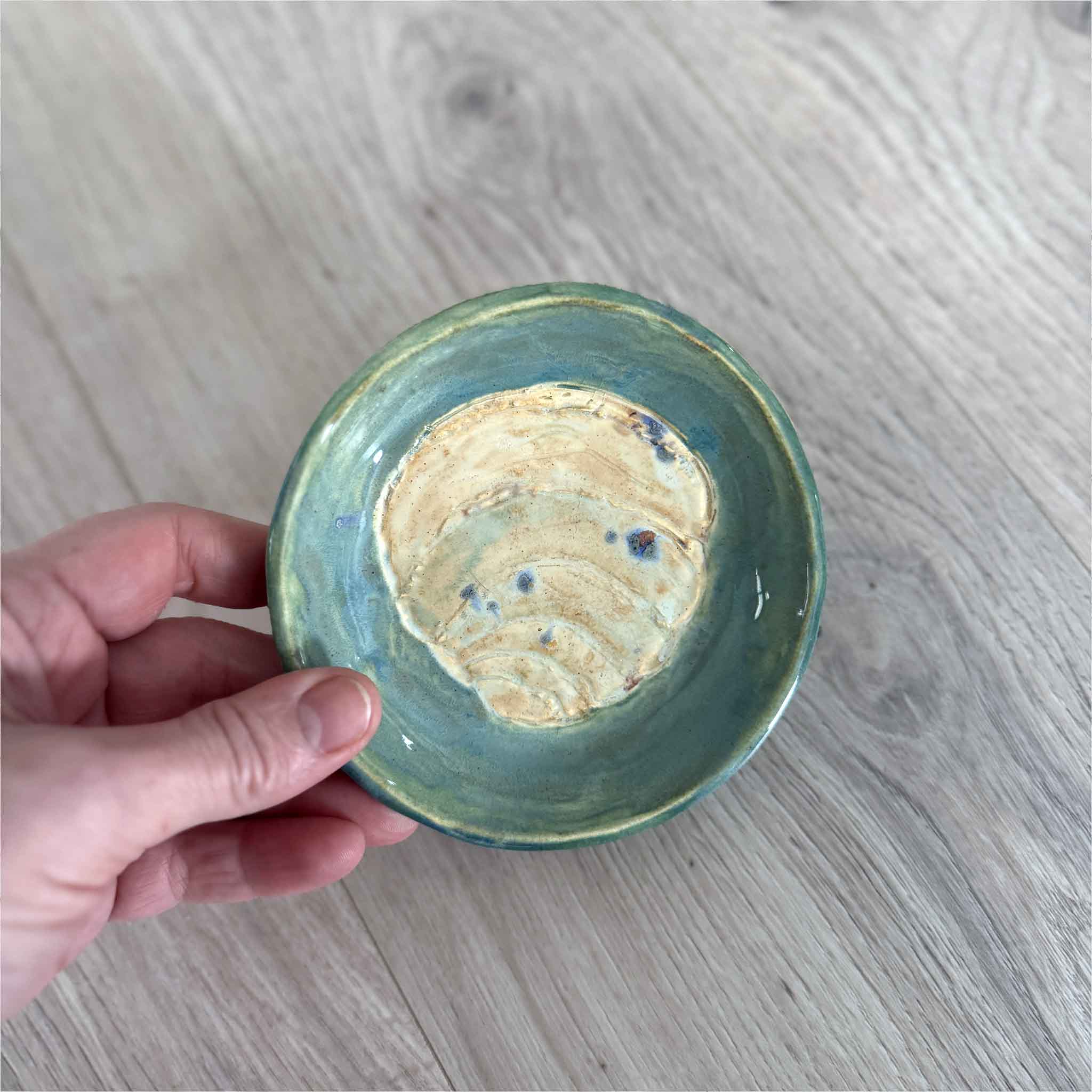 Handmade Pawleys Island shell ceramic dish by Vida Miller with coastal green glaze and carved shell design, perfect for holding rings or small treasures.