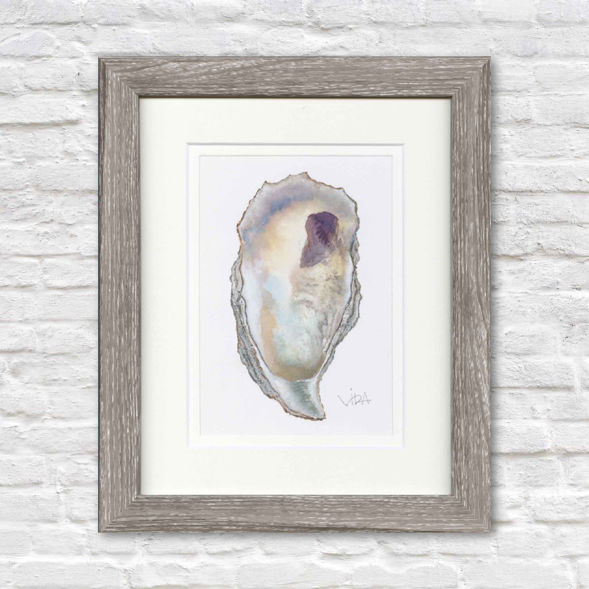Original watercolor painting, Pawleys Oyster Shell VIII by Pawleys Island artist Vida Miller, professionally double matted and framed in a weathered gray wood frame. Gentle washes of pearl white, pale aqua, warm gold, and soft lavender bring this original oyster shell to life, creating refined coastal artwork inspired by the natural beauty of Pawleys Island.