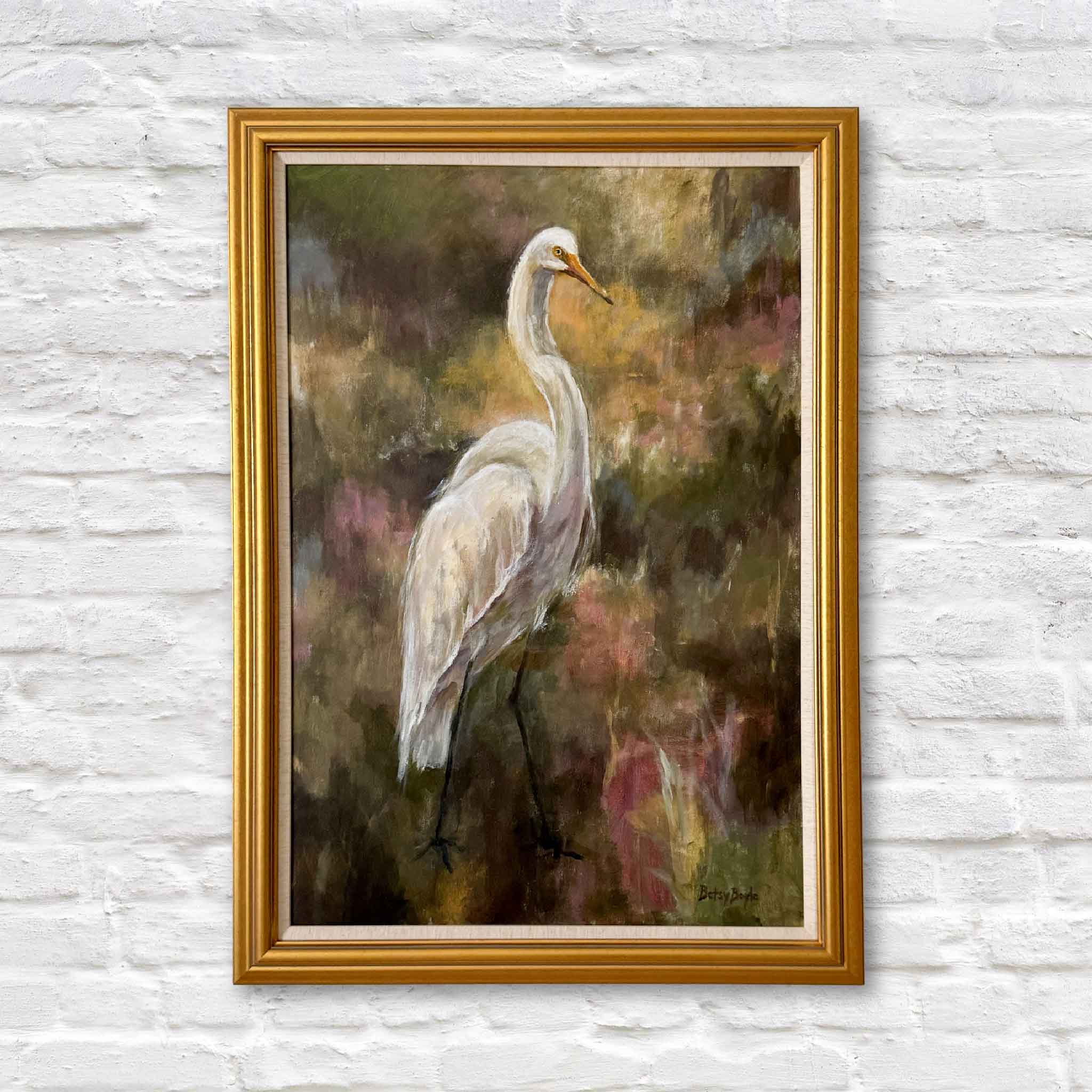 Original acrylic painting “Watching” by local artist Betsy Boyle featuring a white egret in a Lowcountry marsh, professionally framed and displayed at Gray Man Gallery in Pawleys Island, South Carolina