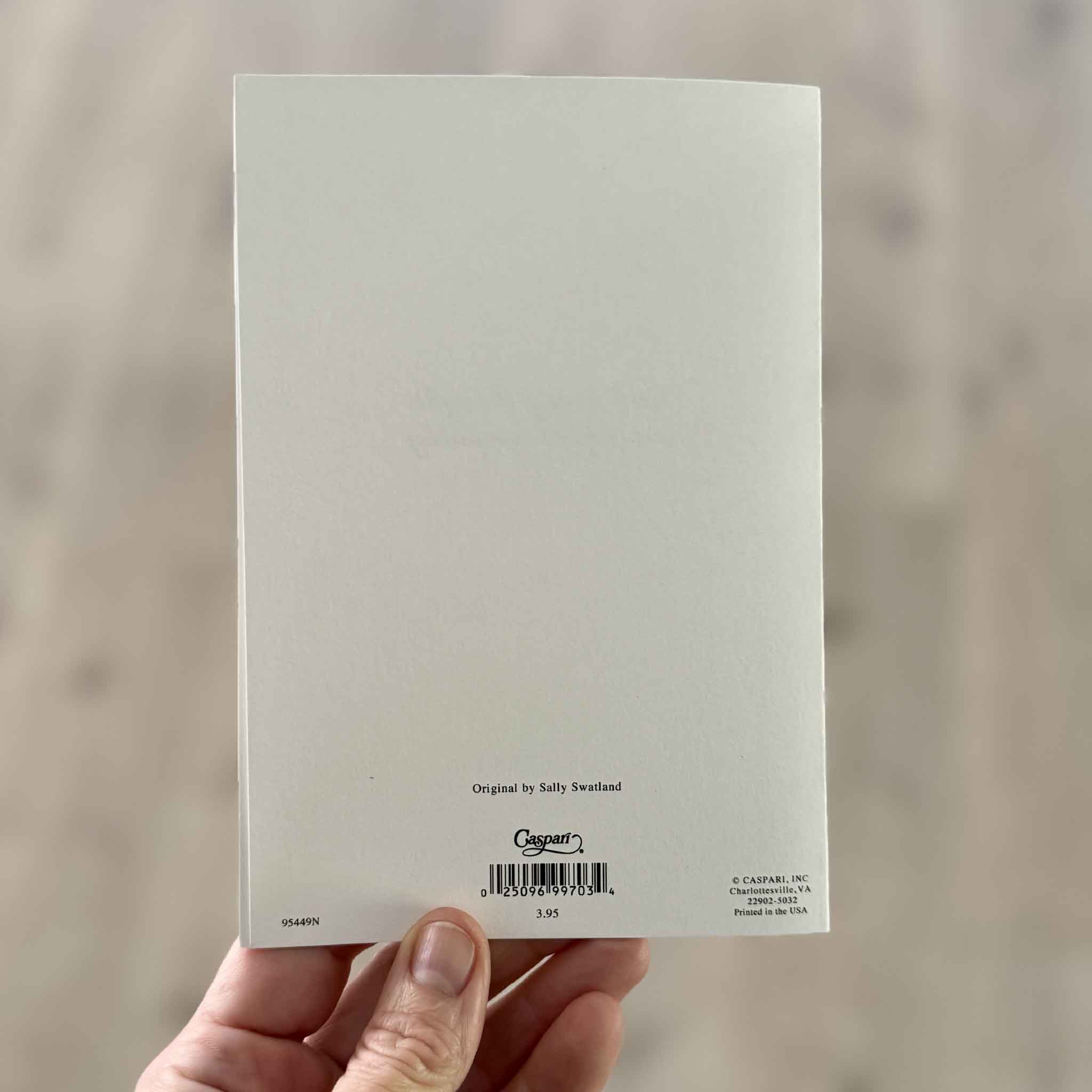 Back of the Caspari Water Lilies sympathy greeting card by Sally Swatland showing artist attribution, Caspari branding, barcode, and premium folded card construction. Printed in the USA and available at Gray Man Gallery in Pawleys Island, South Carolina.