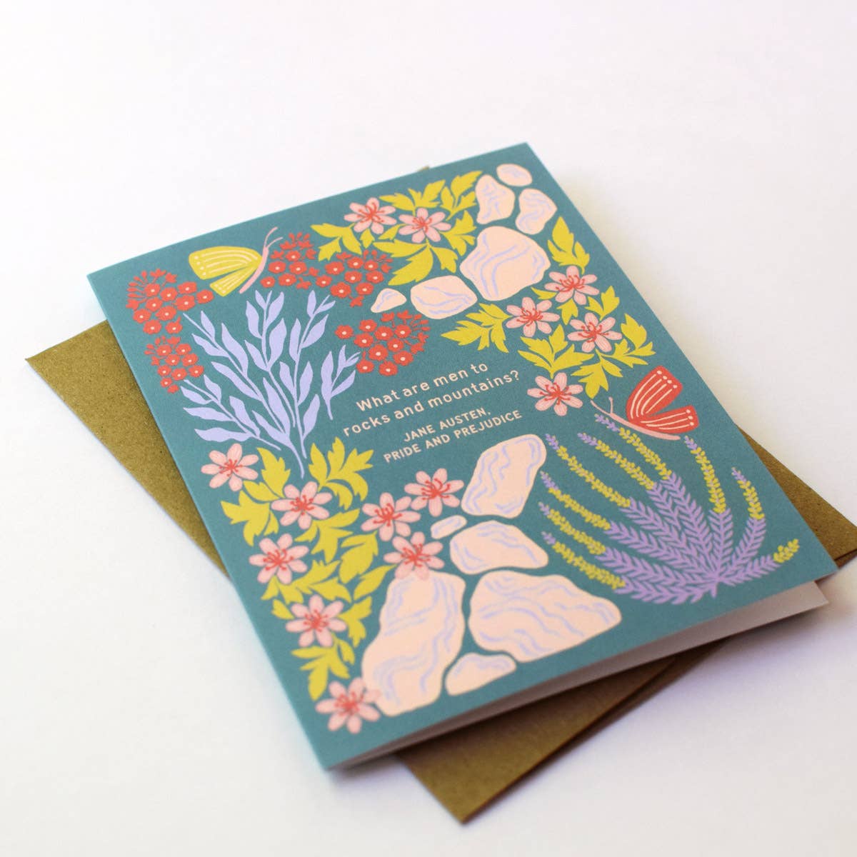 Open view of the "What Are Men to Rocks and Mountains?" Jane Austen greeting card by Chrissie Van Hoever displayed with its recycled kraft envelope, showcasing the eco-friendly materials and literary-inspired botanical artwork available at Gray Man Gallery in Pawleys Island, South Carolina.