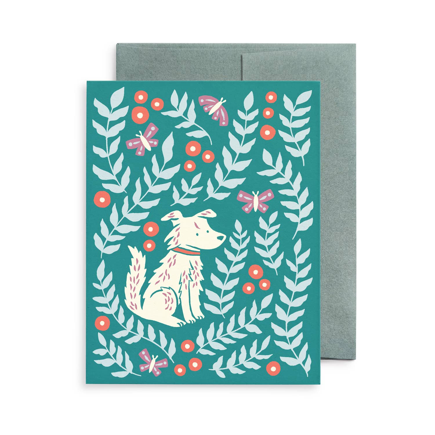 Blank greeting card featuring an original illustration by Chrissie Van Hoever of a white dog surrounded by leafy botanical branches, berries, and butterflies on a rich teal background. Printed on recycled paper with a matching kraft envelope and available individually or in the Dogs & Blooms boxed set at Gray Man Gallery in Pawleys Island.