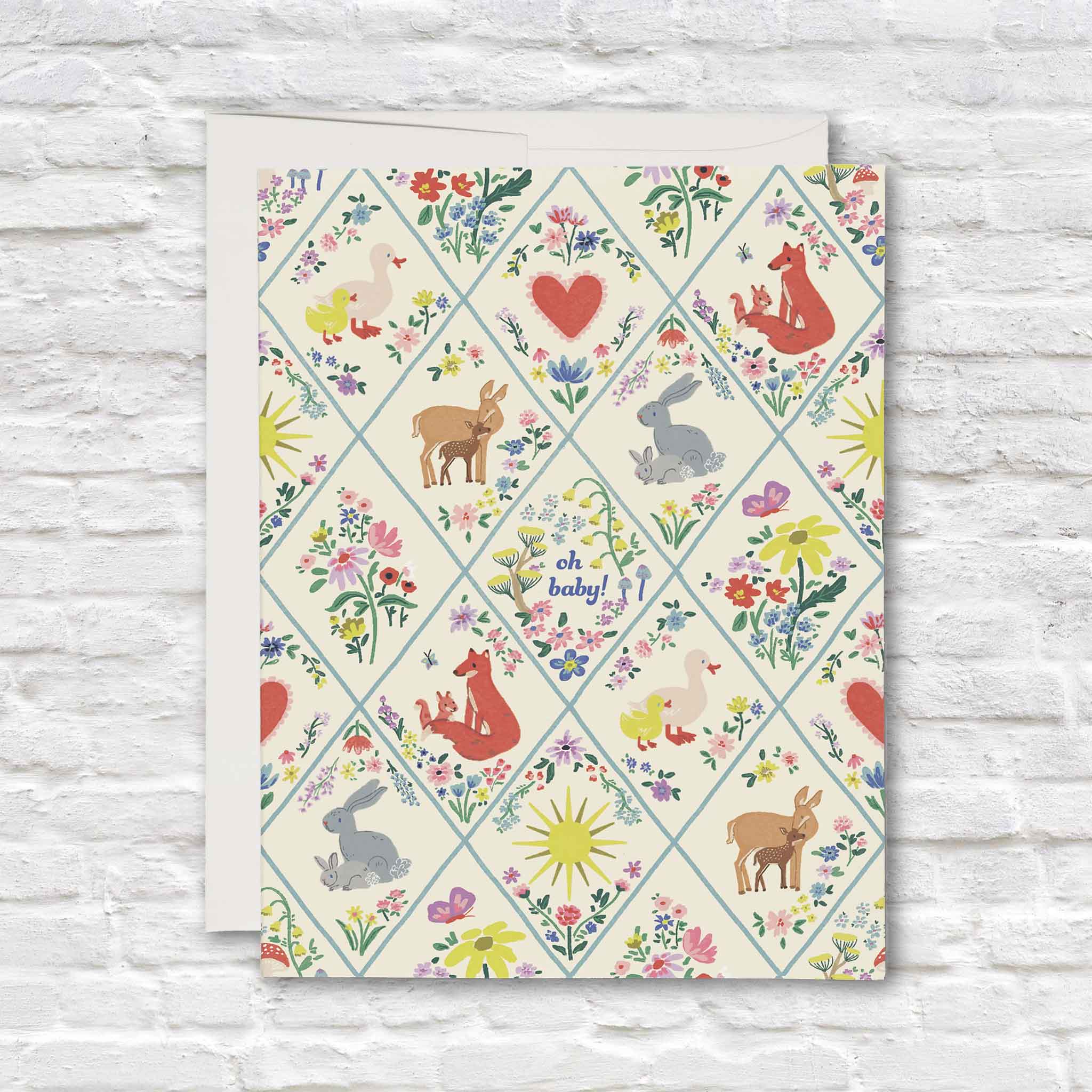 Woodland Critters baby greeting card by The House That Lars Built featuring foxes, rabbits, ducklings, deer, wildflowers, and whimsical storybook illustrations for celebrating a new baby. Shop at Gray Man Gallery in Pawleys Island, South Carolina.