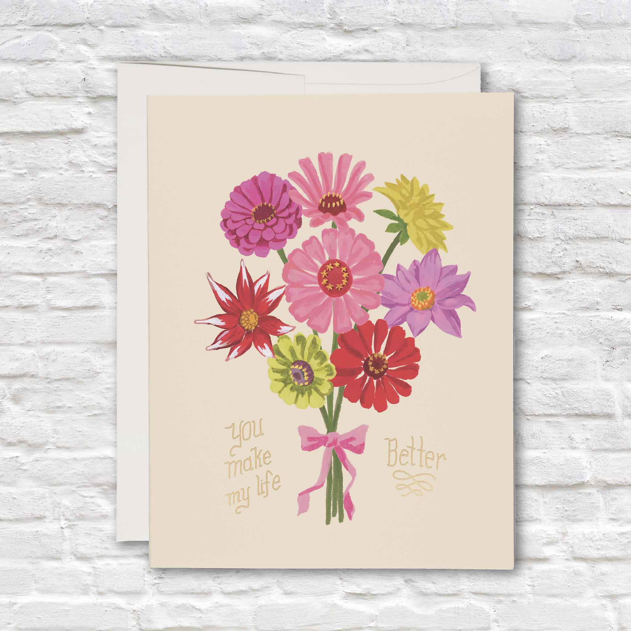 You Make My Life Better floral greeting card featuring a colorful hand-painted bouquet of pink, red, purple and chartreuse flowers tied with a pink bow and accented with metallic gold foil lettering, available at Gray Man Gallery in Pawleys Island, South Carolina.